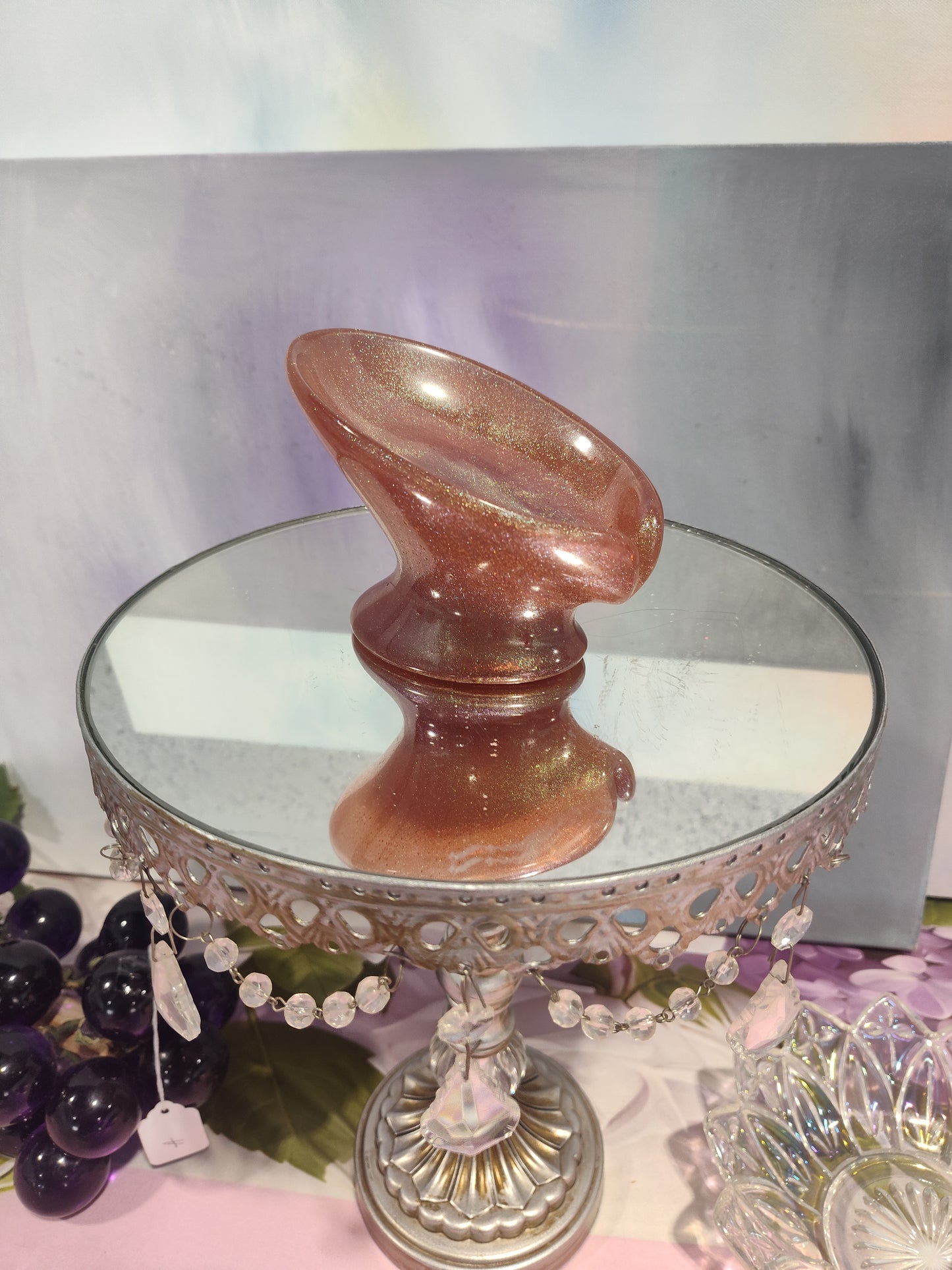 Peach-colored draining soap dish from The Rose Soaps Candles Etc, designed to keep soap dry and organized in bathroom spaces.
