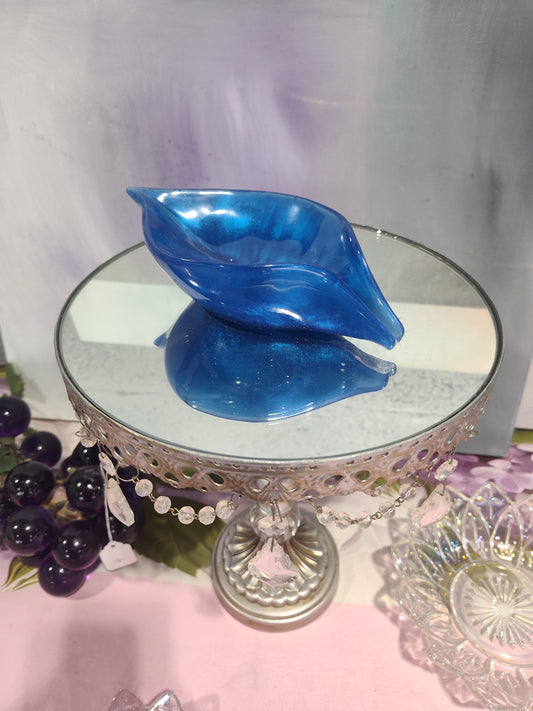 Blue conch-shaped draining soap dish from The Rose Soaps Candles Etc, designed for holding and draining soap bars.