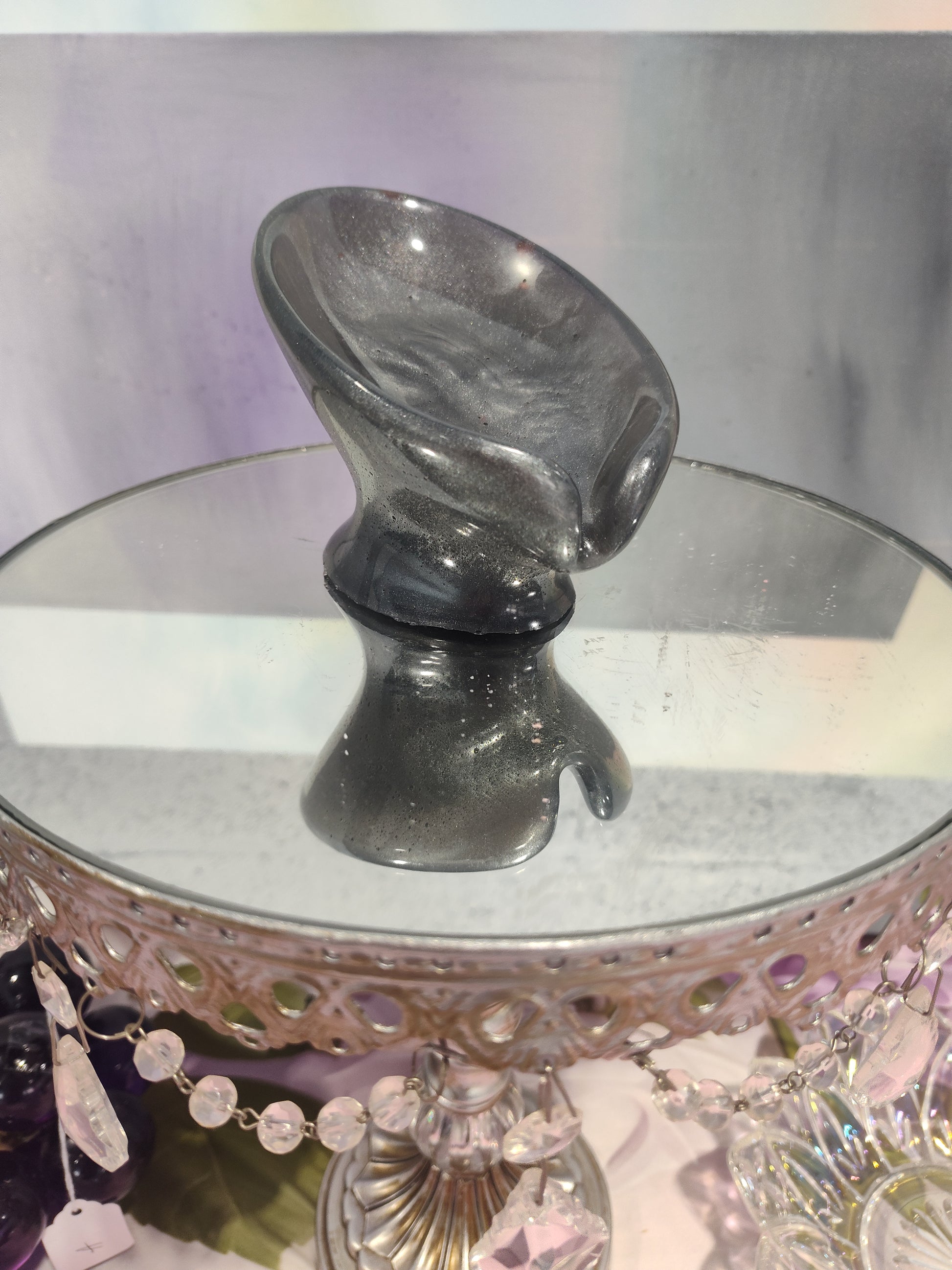 Black and gray draining soap dish by The Rose Soaps Candles Etc, designed to keep soap dry and organized in the bathroom.