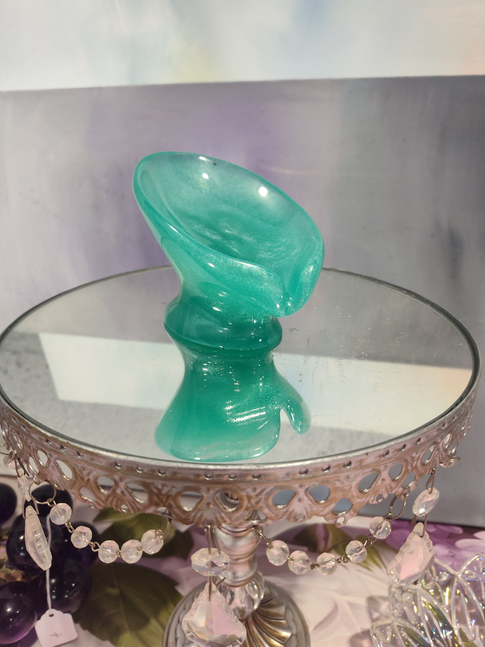 Light green draining soap dish by The Rose Soaps Candles Etc, designed to keep soap dry and organized in bathroom spaces.