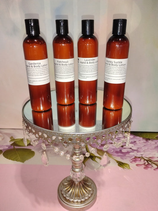 Creamy hand and body lotion from The Rose Soaps Candles Etc, featuring a sleek bottle with a soft, soothing appearance.